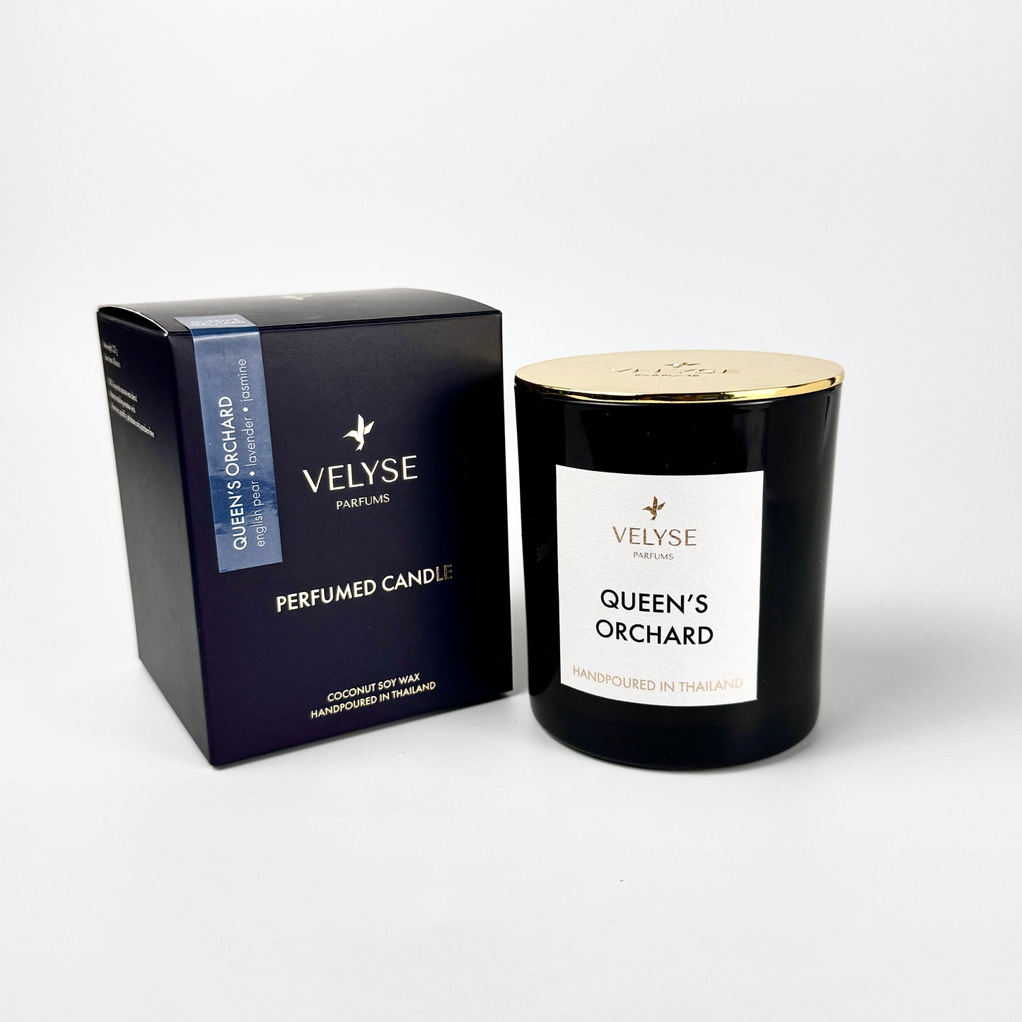 Queen’s Orchard luxury candle with gold metal lid and packaging box