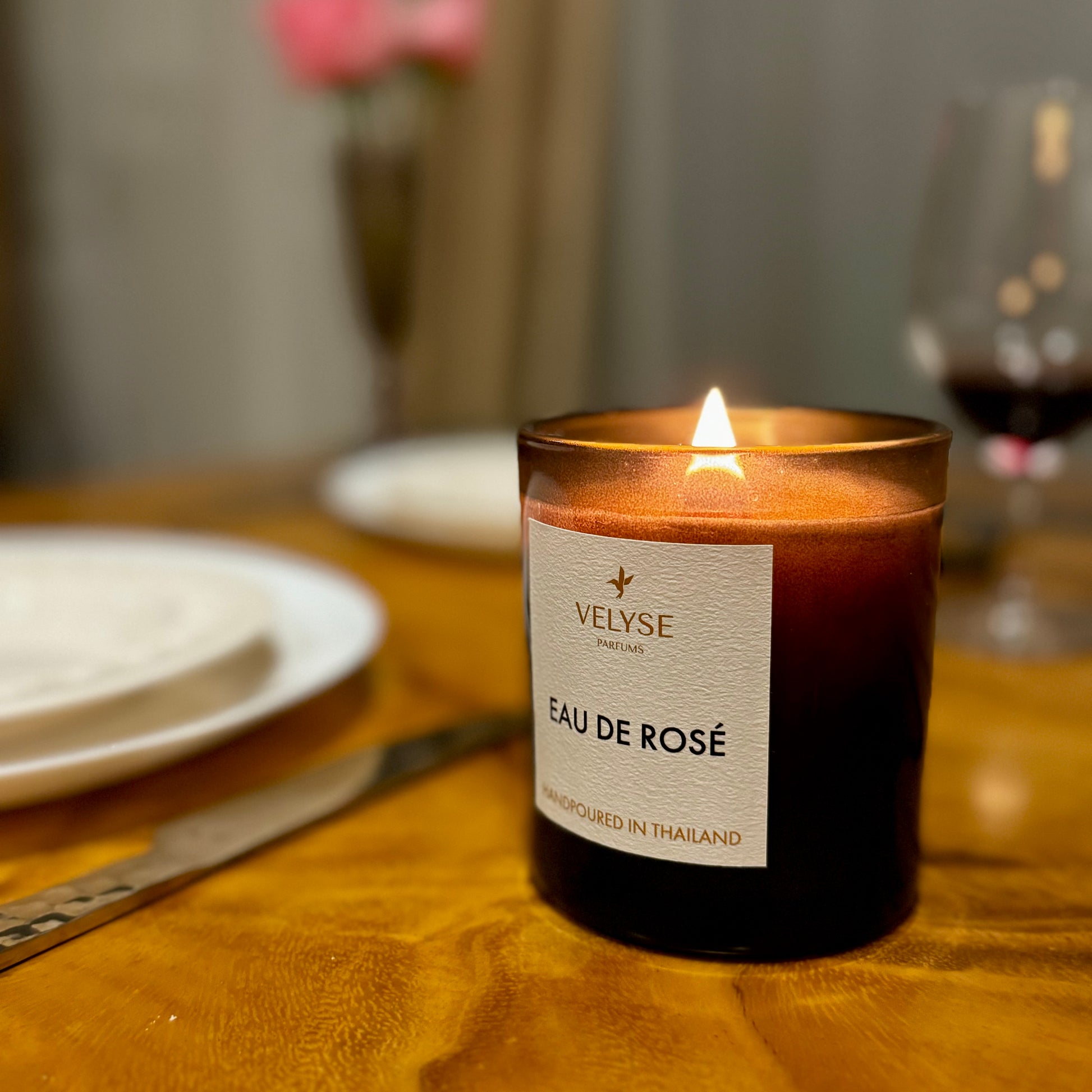 Eau de Rosè luxury candle burning during romantic dinner