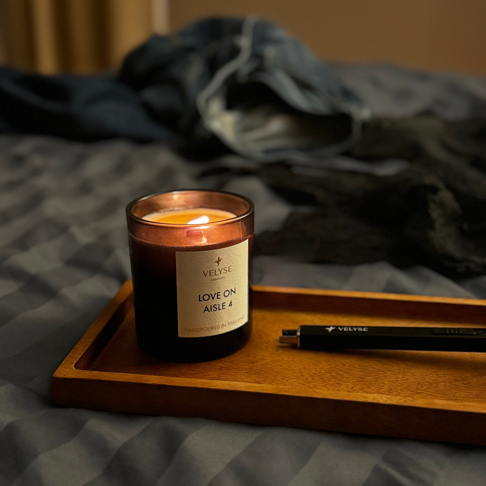 Love on Aisle 4 luxury candle burning in the bedroom before intimate night