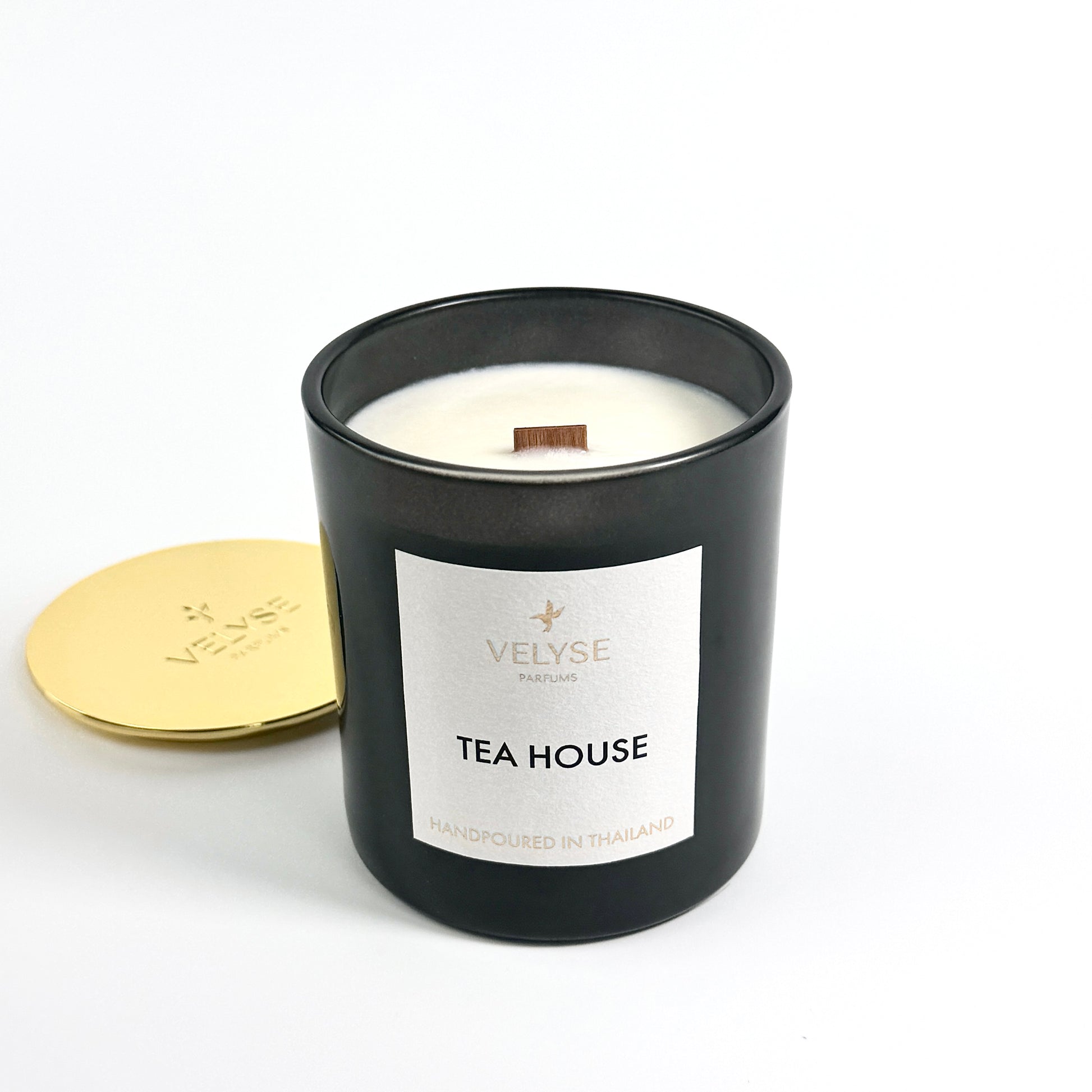 Tea House luxury candle burning