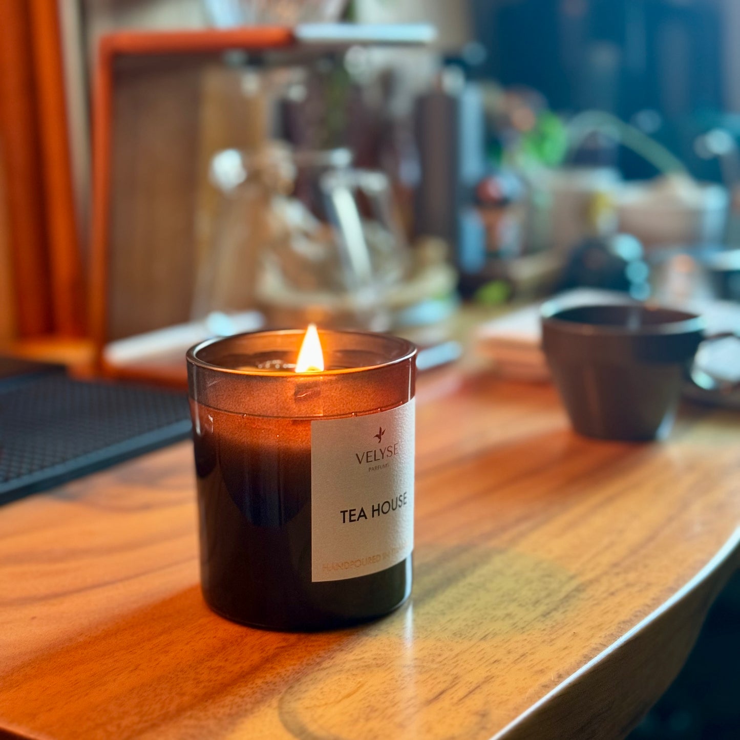 Tea House luxury candle burning in kitchen